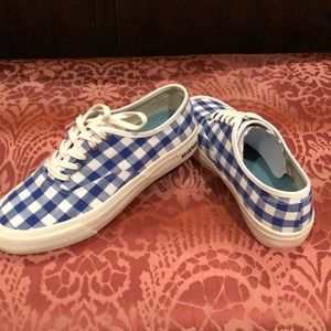 Blue and white checked tennis shoes